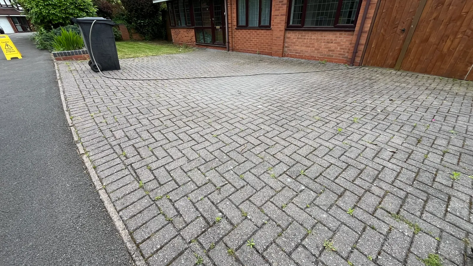 Block paving driveway before jet washing