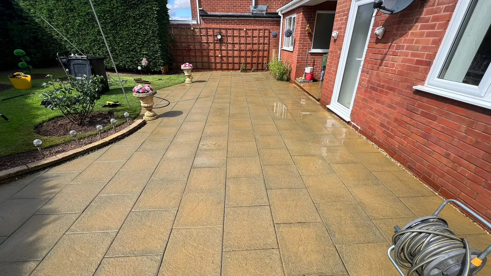 Large patio slabs after cleaning in sunlight