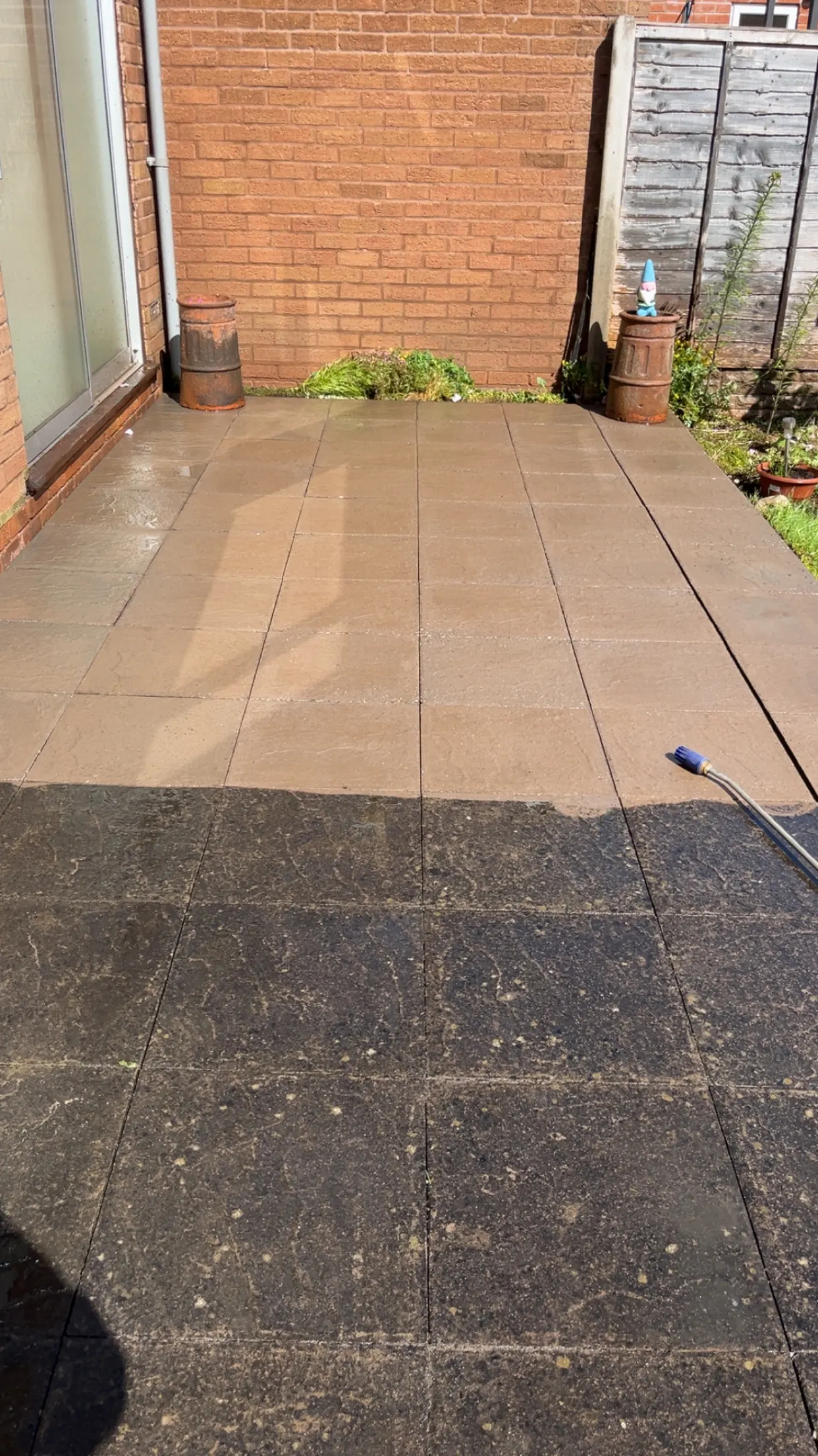 Patio halfway through jet washing