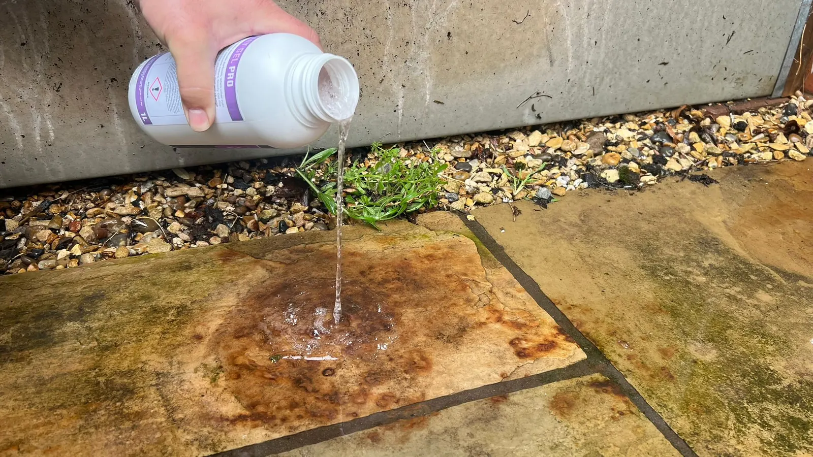 Stain treatment being poured on sandstone