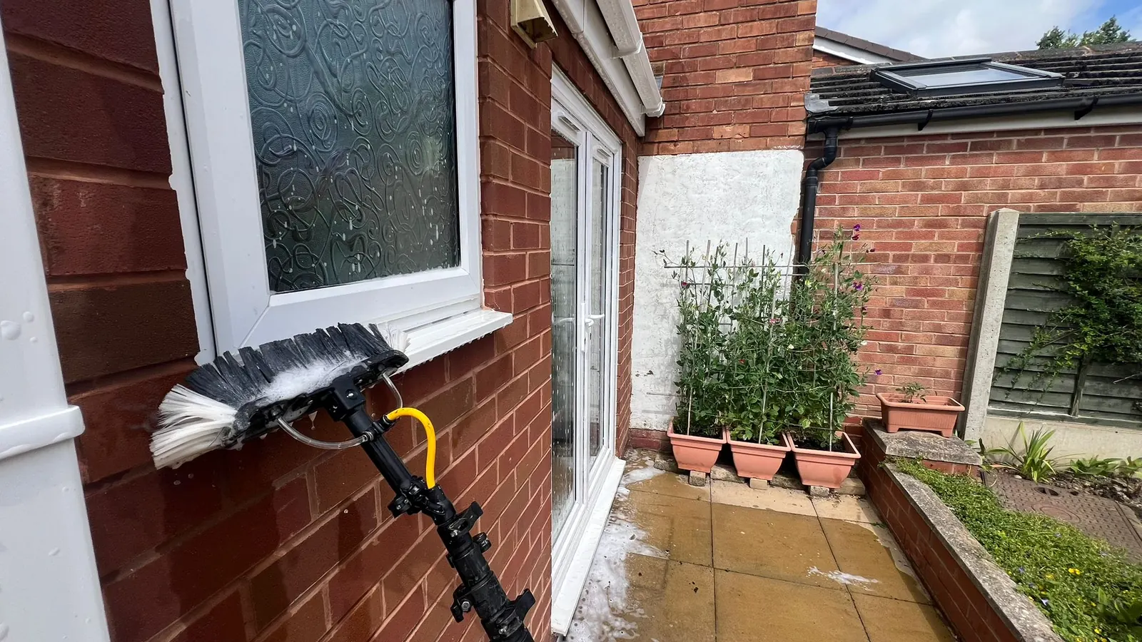 Brush washing window sills and doors in Bromsgrove